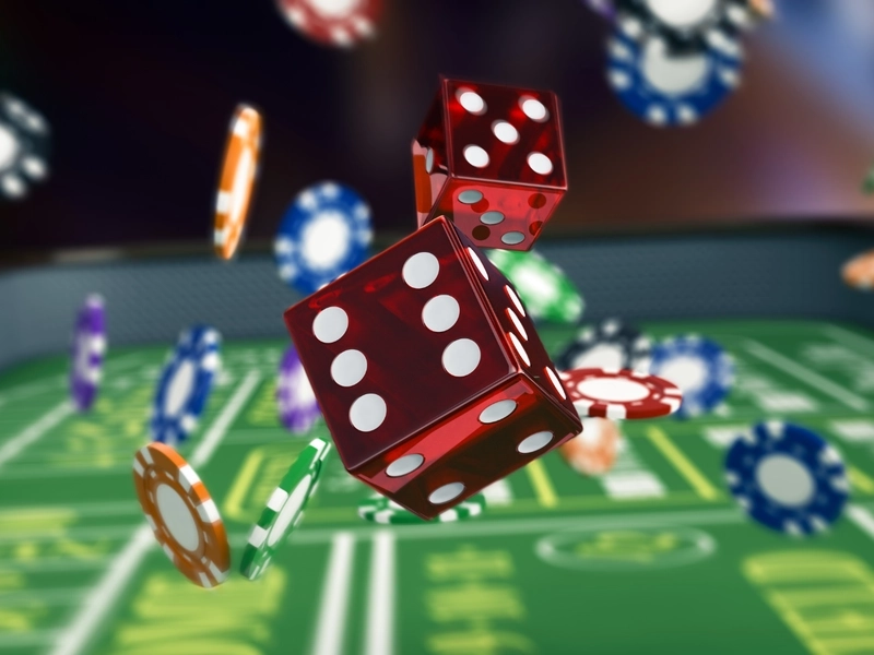 Kostki i żetony do gry rzucane w powietrze w kasynie